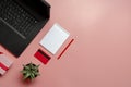 Credit card, laptop and christmas presents on pink background flat lay, copy space. Christmas shopping Royalty Free Stock Photo