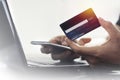 Credit card. With mobile phone for online shopping  E-payment technology. Royalty Free Stock Photo