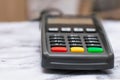 The credit card payment terminal is on the table in the store. Close-up of contactless payment device, card machine Royalty Free Stock Photo