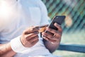 Credit card, phone and online shopping with a sports man making a payment online while sitting at a court. Finance Royalty Free Stock Photo