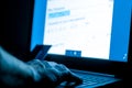 Credit card thief on laptop . Royalty Free Stock Photo