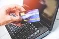 Credit card and using laptop easy payment online shopping concept - electronic card in hand for pay online Royalty Free Stock Photo