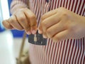 A credit card in a woman`s hands being folded and destroyed - breaking free of financial bondage