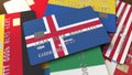 Many credit cards with different flags, emphasized bank card with flag of Iceland. 3D rendering