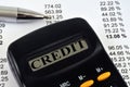 Credit concept with a calculator and lists of numbers Royalty Free Stock Photo