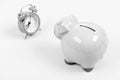 Credit debt. It is time to pay. Piggy bank pink pig and little alarm clock. Financial crisis. Economics and finance