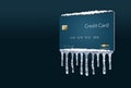 A credit freeze, or freeze on your credit report is represented with icicles and snow on a mock credit card isolated on the backgr