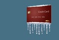 A credit freeze, or freeze on your credit report is represented with icicles and snow on a mock credit card isolated on the backgr