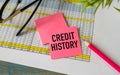 Credit History. text on white paper on wood table background Royalty Free Stock Photo