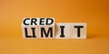 Credit and limit symbol. Turned wooden cubes with words credit and limit. Beautiful orange background. Business and Credit limit