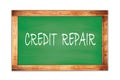 CREDIT REPAIR text written on green school board