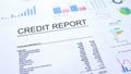 Credit report lying on table, graphs charts and diagrams, official document Royalty Free Stock Photo