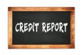 CREDIT REPORT text written on wooden frame school blackboard