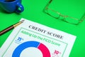 The credit score form on the green office desk with glasses and stylish pen Royalty Free Stock Photo