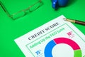 The credit score form on the green office desk with glasses and stylish pen, business idea Royalty Free Stock Photo