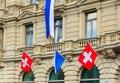 Credit Suisse building at Paradeplatz square in the city of Zurich decorated with flags