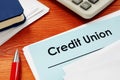 Credit Union papers for loan on desk