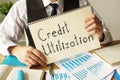 Credit Utilization is shown on the conceptual business photo