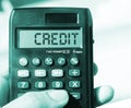 Credit word on calculator display on relaxed beach background. Concept for business and Finance Royalty Free Stock Photo