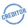 CREDITOR text written on blue grungy round stamp