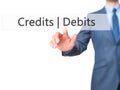 Credits Debits - Businessman hand pressing button on touch scre Royalty Free Stock Photo