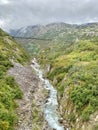 Creek bed of water running through the mountains under an abandoned trestle train tracks Royalty Free Stock Photo