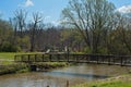 Creek, bridge, play area in spring Royalty Free Stock Photo