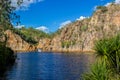 The creek carrying the clear water of Edith Falls Lelyin with the rock wall reflecting in the water, Nitmiluk National Park, Royalty Free Stock Photo