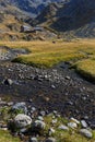 Creek on La Pra plateau and mountain hut Royalty Free Stock Photo