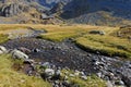 Creek on La Pra plateau and mountain hut Royalty Free Stock Photo