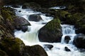 Creek with running water and stones (rocks) Royalty Free Stock Photo