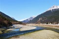 Creek in Skagway with view of mountains and runway Royalty Free Stock Photo