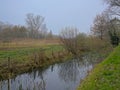 Creek surrounded by trees in the flemish countryside