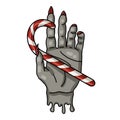 Creepmas. It's a terrible Christmas. Gothic. the witch's grey hand holds a Christmas lollipop