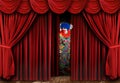 Creepy Clown Looking Through Stage Curtain Drapes Royalty Free Stock Photo