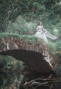 Creepy dead bride on the bridge. Halloween scene