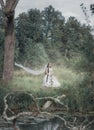 Creepy dead bride in the forest. Halloween scene