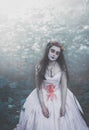 Creepy dead bride in forest. Halloween scene