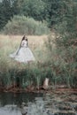 Creepy dead bride in the forest. Halloween scene