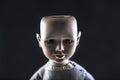 Creepy doll face on dark background Royalty Free Stock Photo