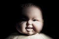 Creepy doll face. It seems like character of horror movie. Angry baby doll, fear of living ghost. Halloween concept. Low-key Royalty Free Stock Photo