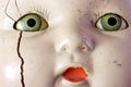 Creepy doll head with green eyes and red lips wins staring contest