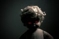 Creepy doll with red glowing eyes