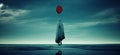 Creepy Ghost Child Floating with a Red Balloon Wet Beach Body Snatcher Dusk Paranormal Royalty Free Stock Photo