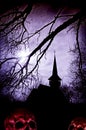 Creepy Halloween background with a silhouette of a church and sk