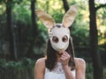 Creepy halloween portrait. Blonde woman in halloween costume.