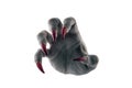 Creepy monster hand with red claws on white background