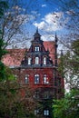 Creepy old house against the blue sky