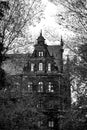 Creepy old house against the blue sky. Black and white Royalty Free Stock Photo