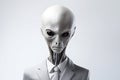 Portrait of an alien in a light suit and tie isolated on a white background. Royalty Free Stock Photo